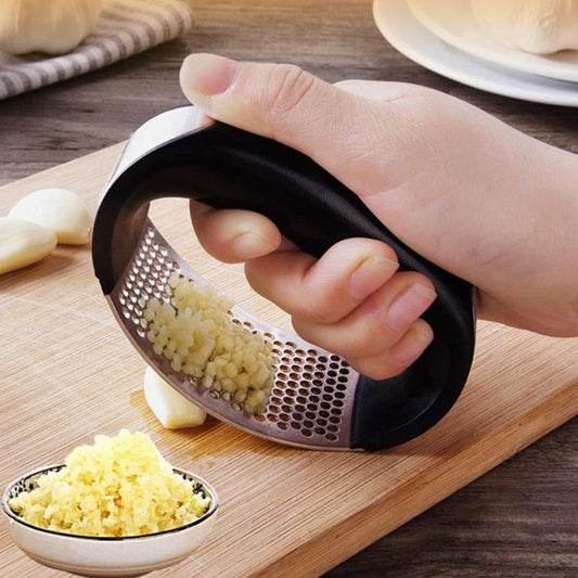 Stainless steel garlic press and slicer